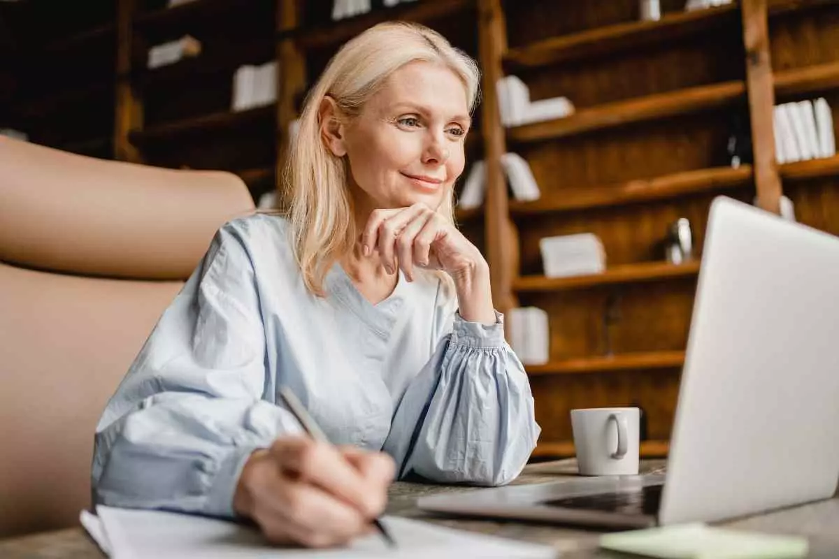 Smiling employee working on laptop