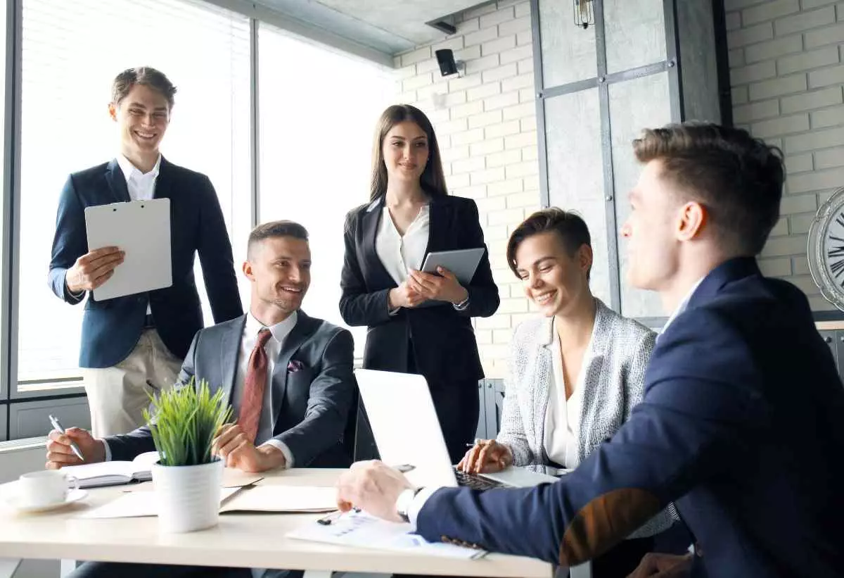 Group meeting with smiling employees 