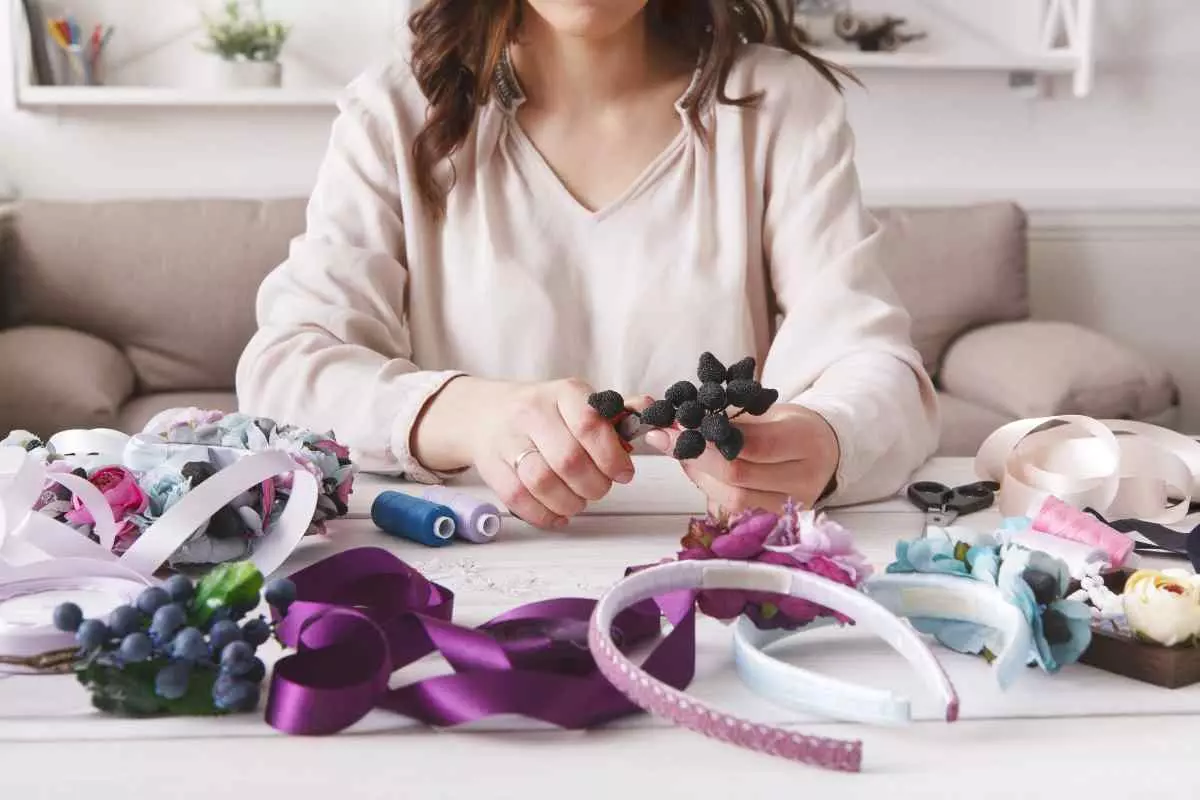 Individual making hair accessories. 