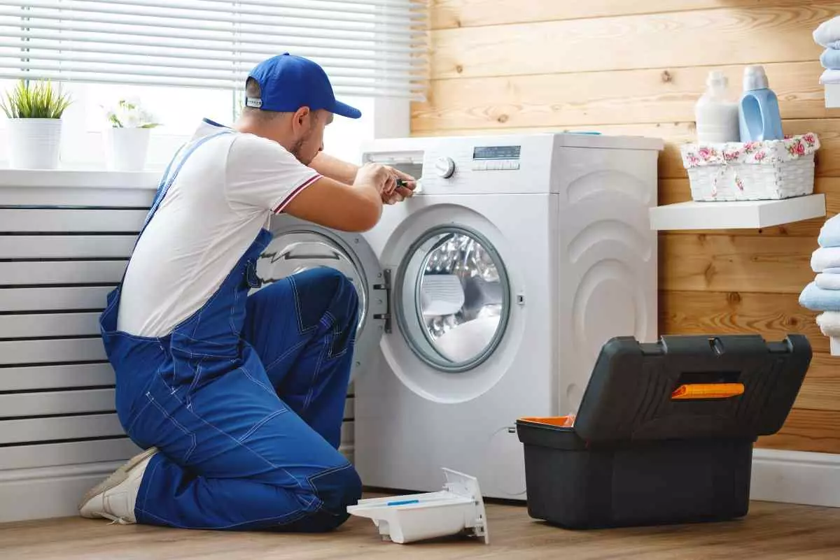 Professional repairing washing machine.