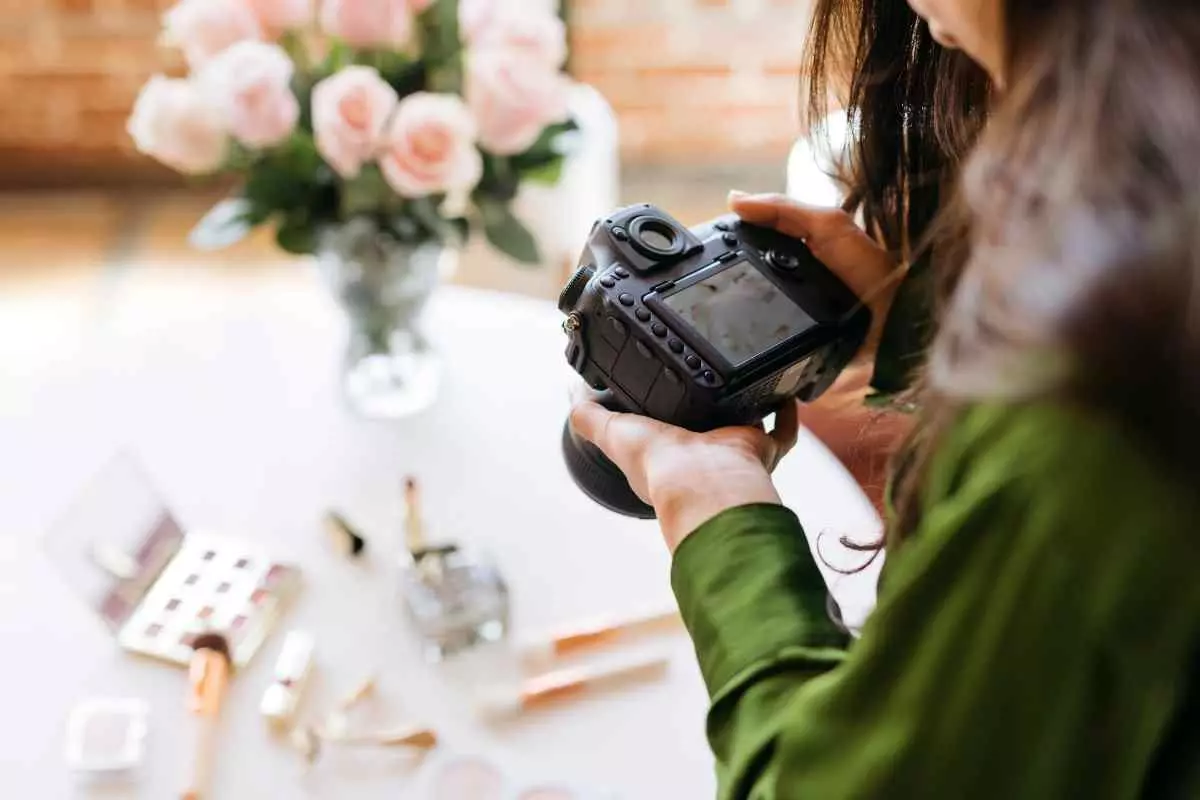 Individual taking photos of their products.