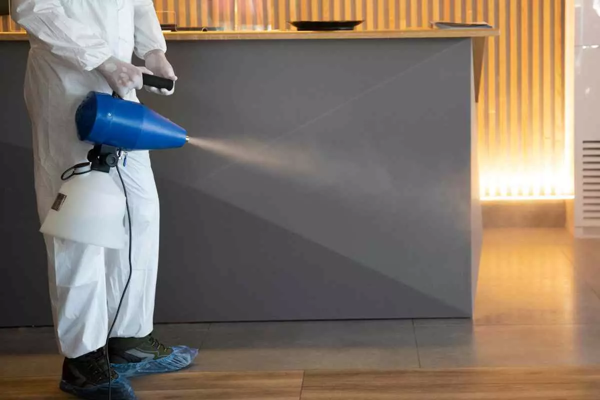 Exterminator spraying chemicals 