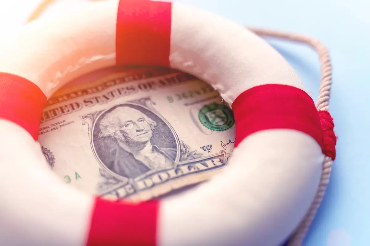 A dollar bill with a lifesaver ring