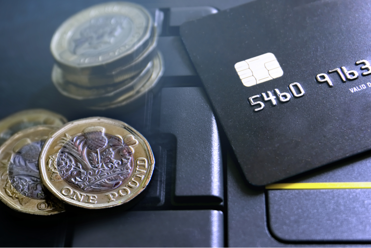 A credit card and pounds coins.