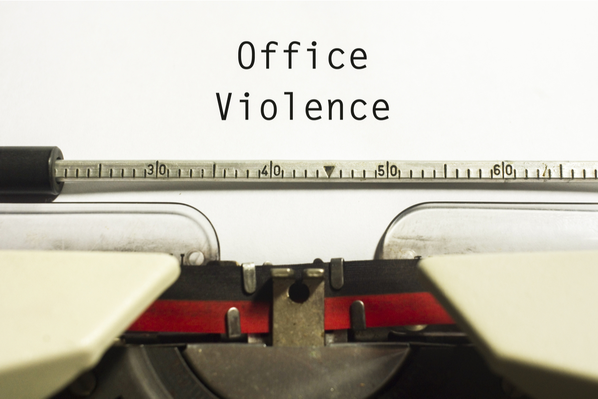 A typewriter with the words "office violence" typed out