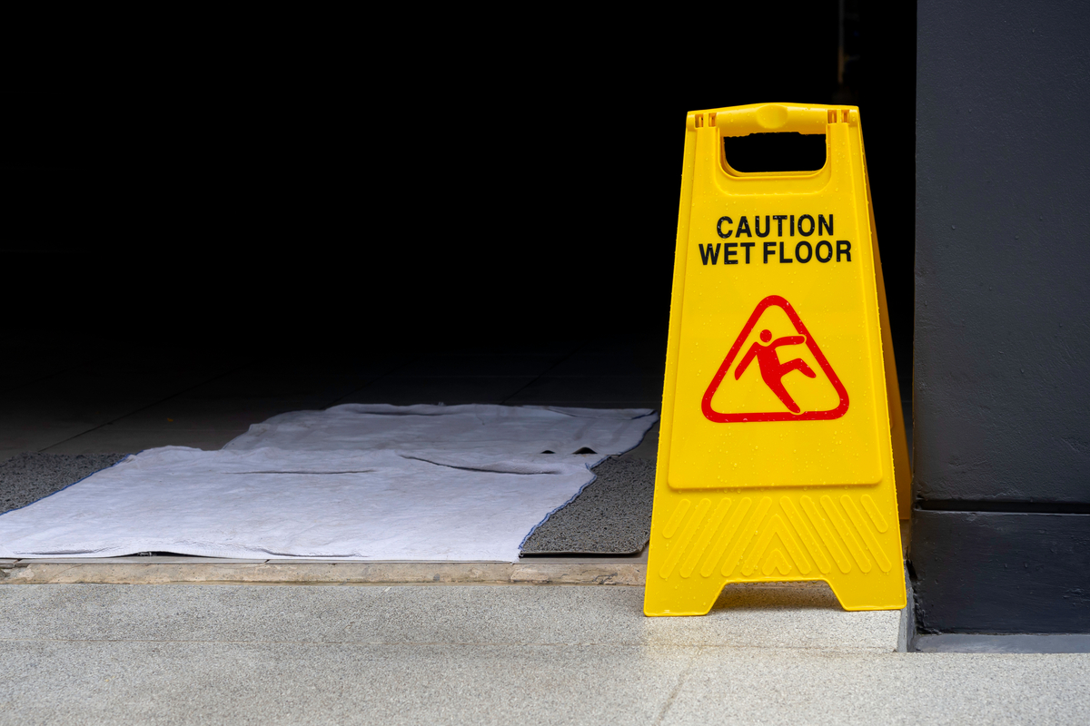 A sign that says caution wet floor.