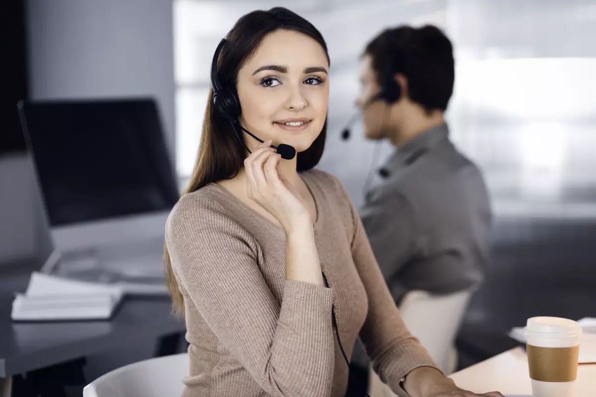 A saleswoman on a call with a client. 