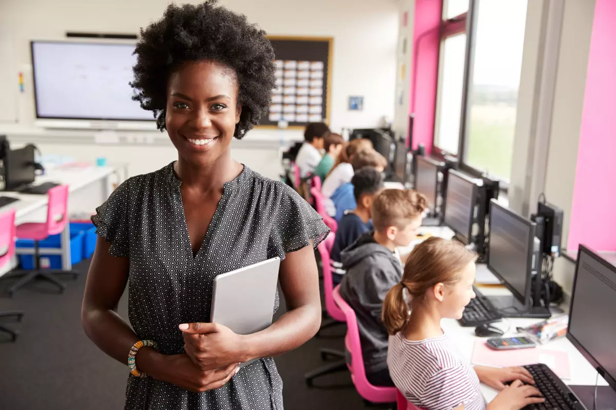 Portrait of a teacher in a classroom.