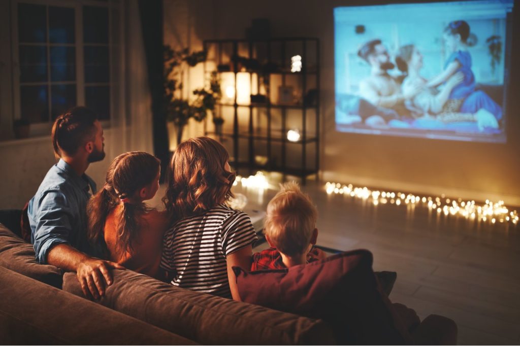 Family watching movie at home.