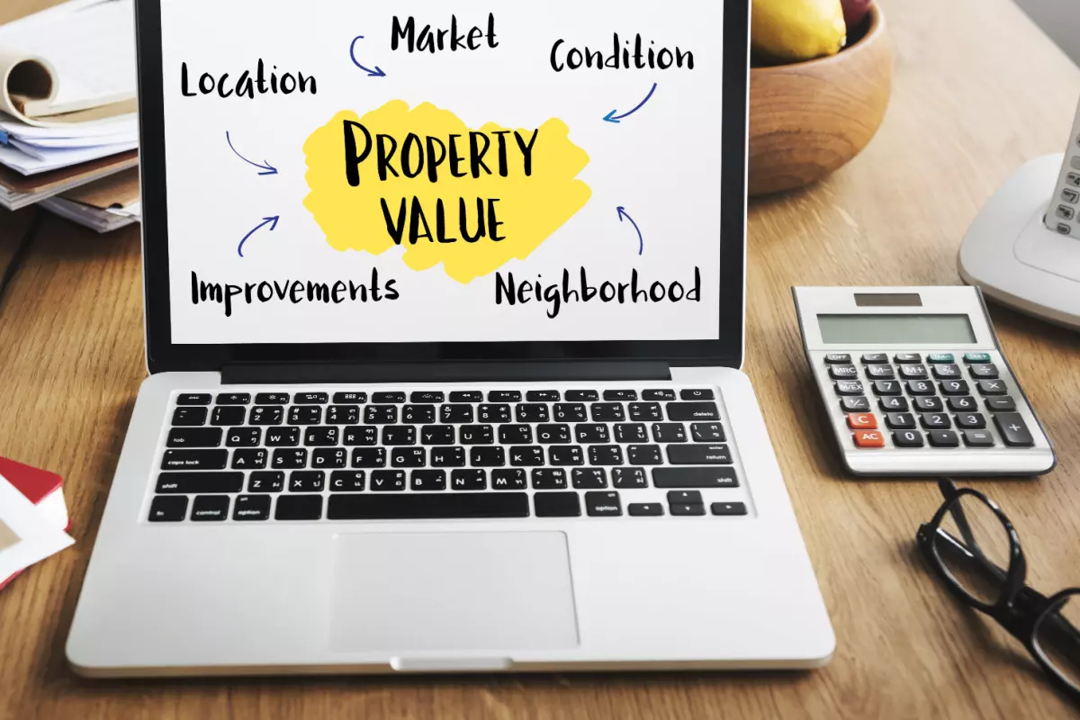 Factors affecting property value on laptop screen