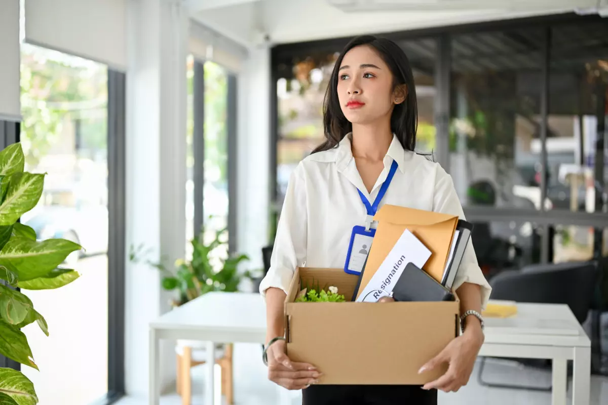 Employee with a box of belongings after resignation